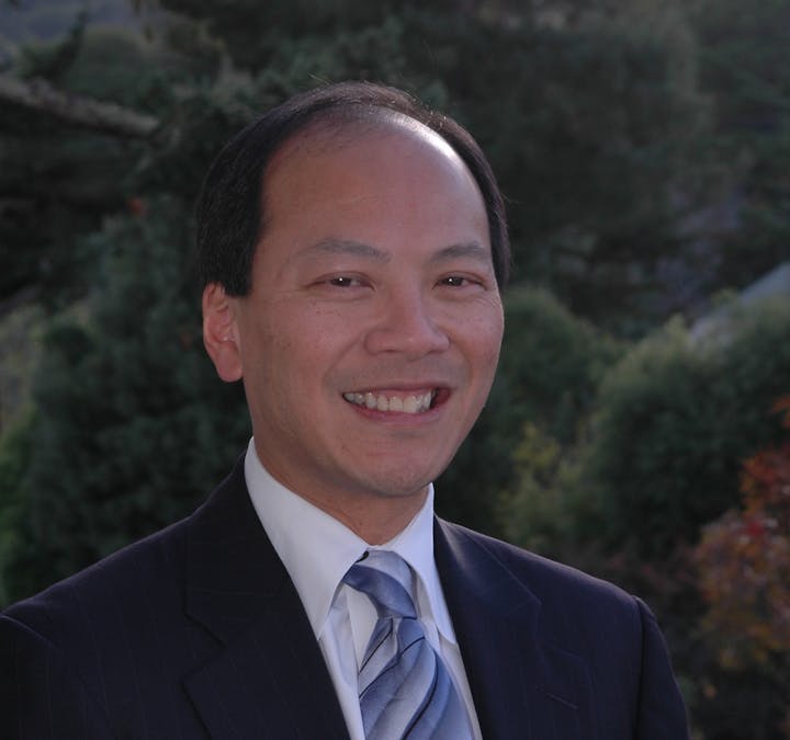 May contain: accessories, formal wear, tie, clothing, suit, necktie, blazer, coat, jacket, adult, male, man, person, face, head, and shirt